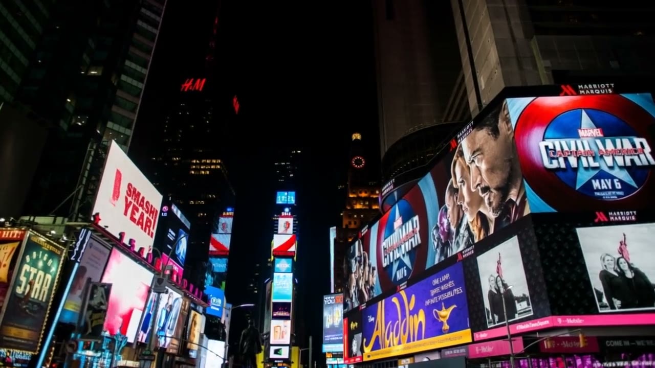 A frame from the Times Square piece: the billboard wall at night.