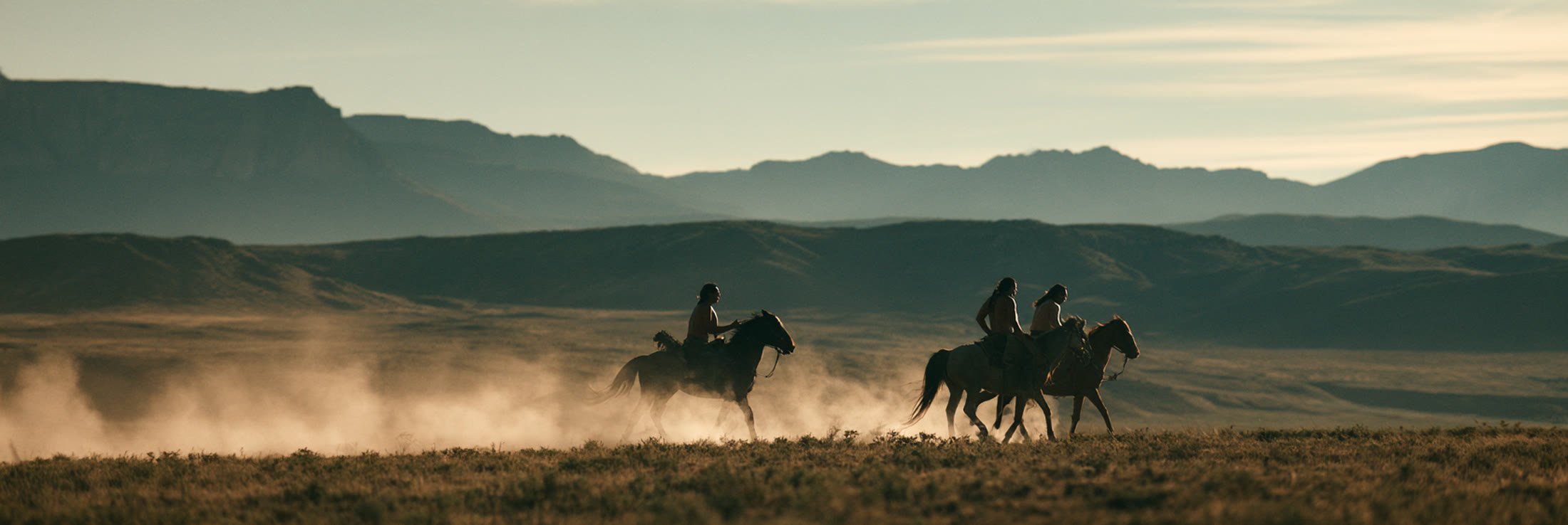 Two parties of riders meet on open ground.